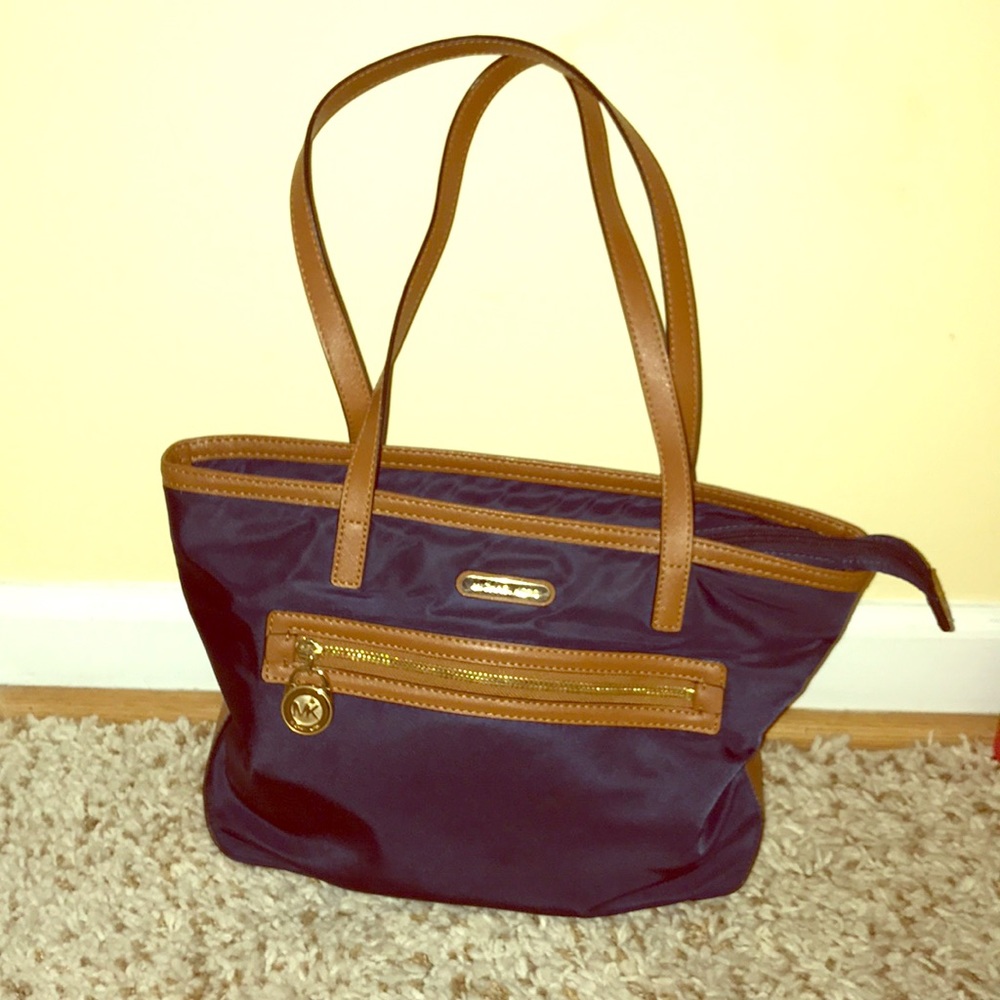 Navy and brown Michael Kors shoulder bag.